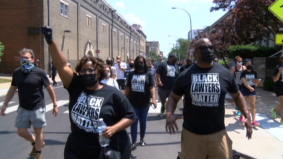 A group of black lawyers marched in Louisville calling for change.