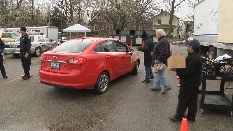 The drive-thru meal program moves to a different community center each weekday
