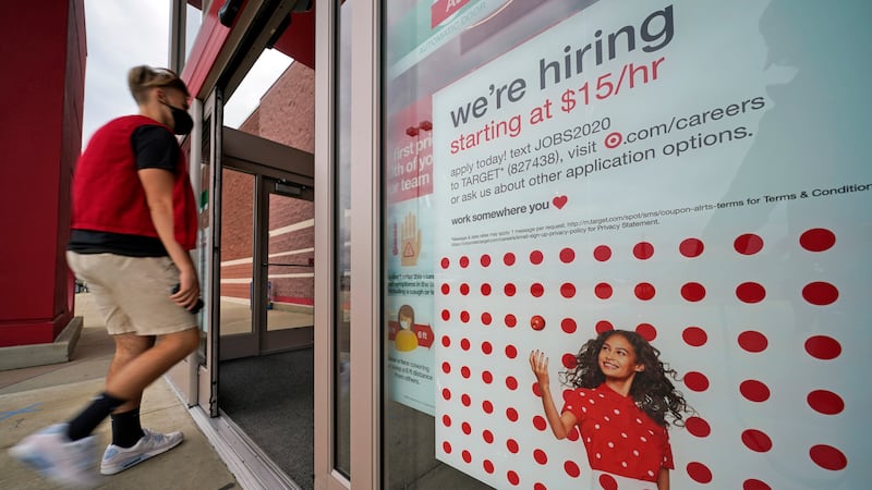 This is a help wanted sign on the door of a Target store in Uniontown, Pa., on Wednesday,...