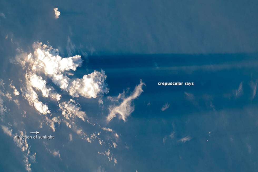 This photo from the International Space Station shows how crepuscular rays are parallel.