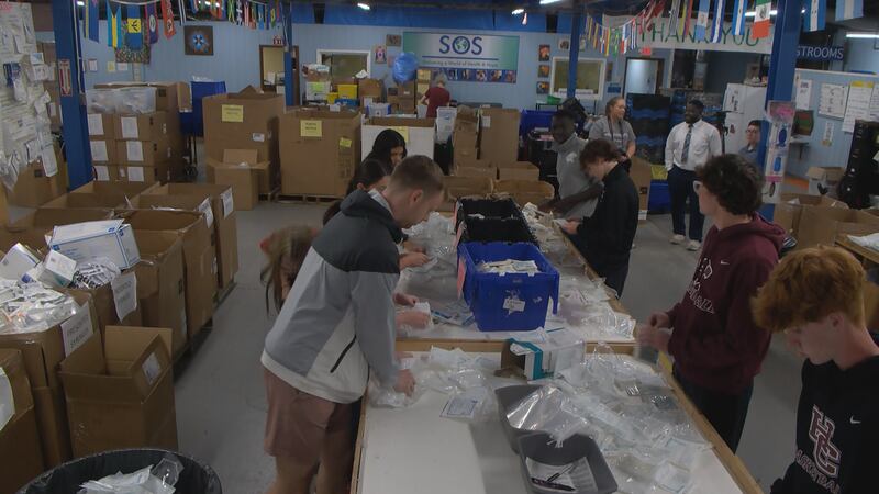 Students from Holy Cross High School were at Supplies Overseas on Arlington Avenue as students...