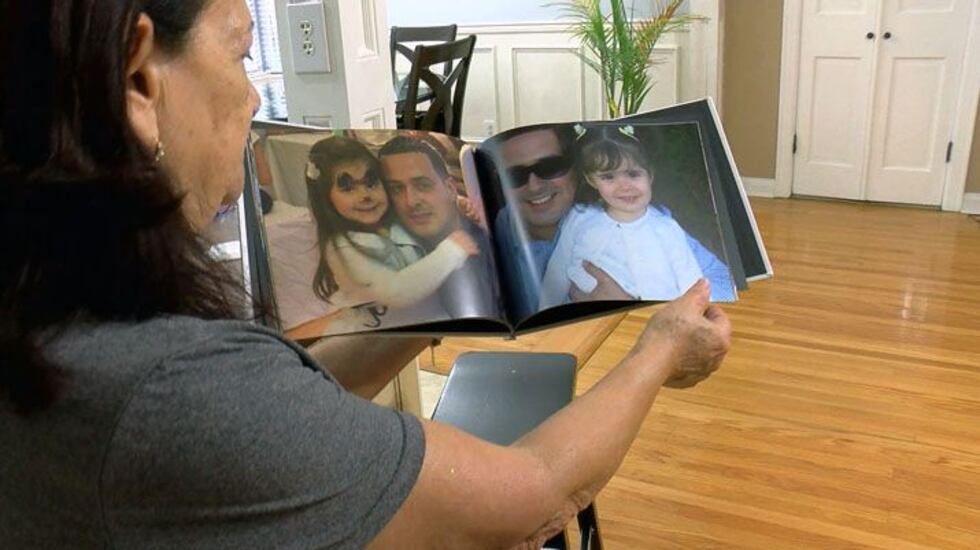 Ricardo's mother flips through a family album. (Source: WAVE 3 News)