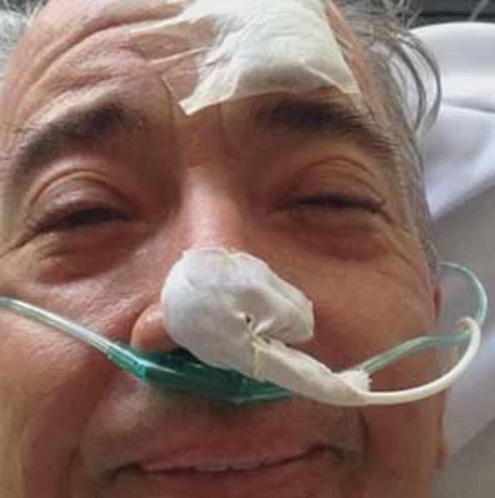 Joe Wolek smiling from his hospital bed in Buenos Aires. (Source: Janeen Obis)