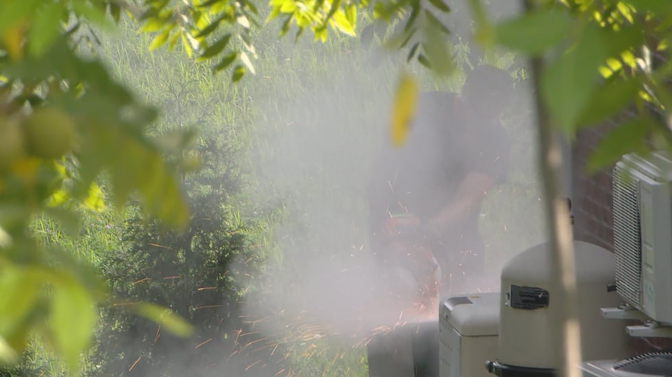 Jeffersonville firefighters cut into a safe outside of Jamey Noel's home.