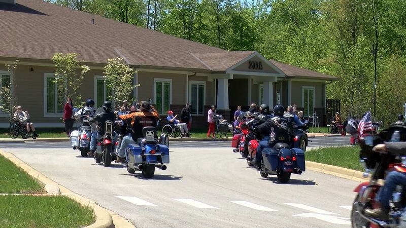 A parade of motorcycles, cars and trucks gathered in Radcliff Monday afternoon to show support...