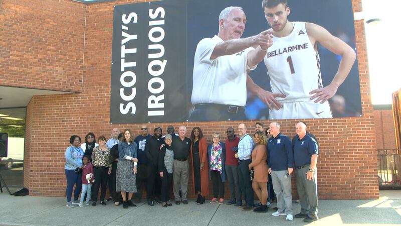 Scotty Davenport was surprised as the banner was revealed along the side of the school in the...