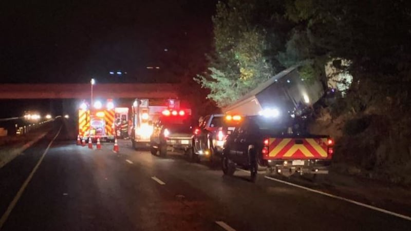 The driver of a semi hit the disabled vehicle then crashed into trees.