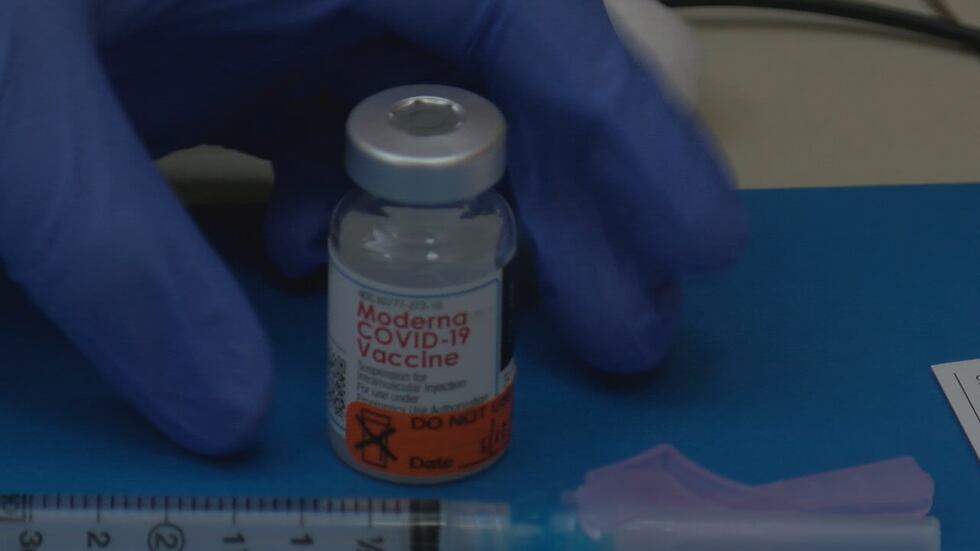 Moderna Covid-19 Vaccine with the label visible before the doctor picks up the vile. Jan....