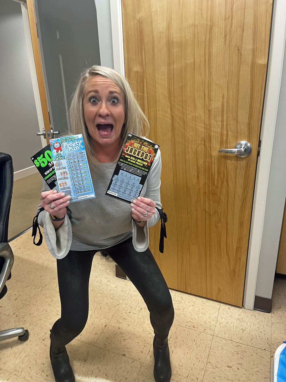 Louisville woman wins lottery scratch-off prize at company holiday party