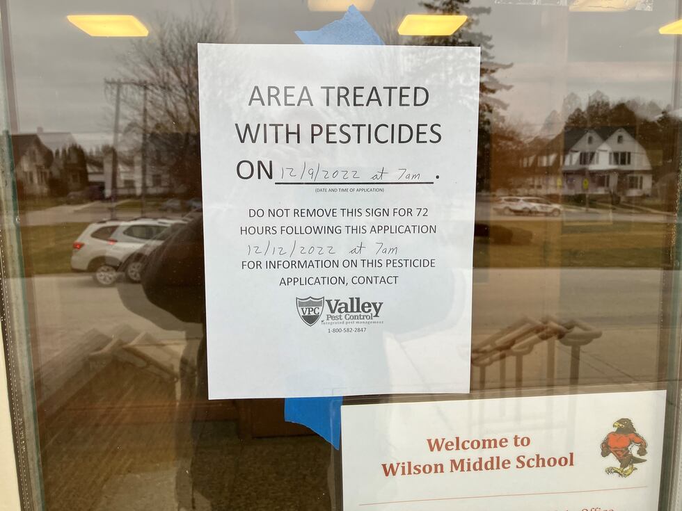 Pest control works to eliminated yellow sac spiders at a Manitowoc school.