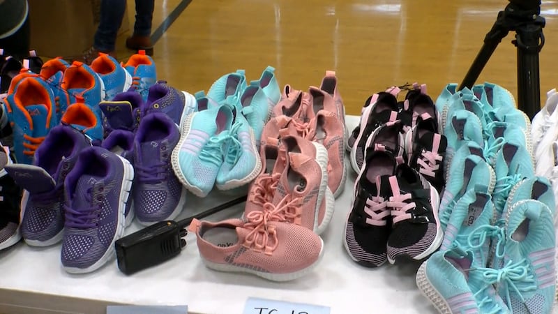 At Hazelwood Elementary on Friday, 500 students took home a book bag with athletic shoes,...