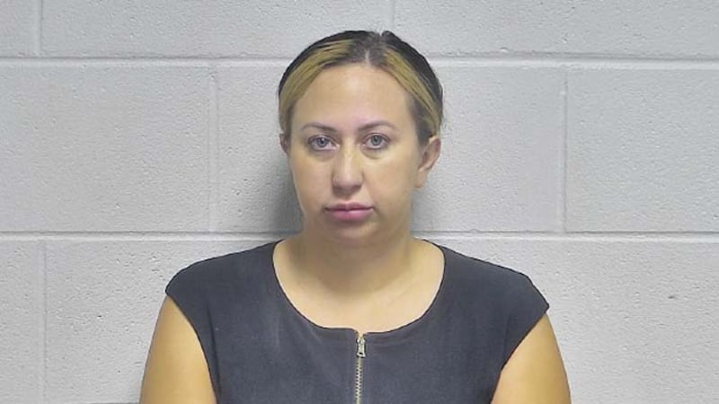Ashlea Nicole Hellmann, 34, a Louisville attorney, is charged with smuggling drugs into an...