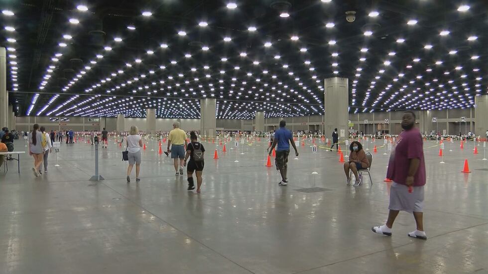 Voters make their way into the Kentucky Fair and Expo Center in Louisville to vote in the...