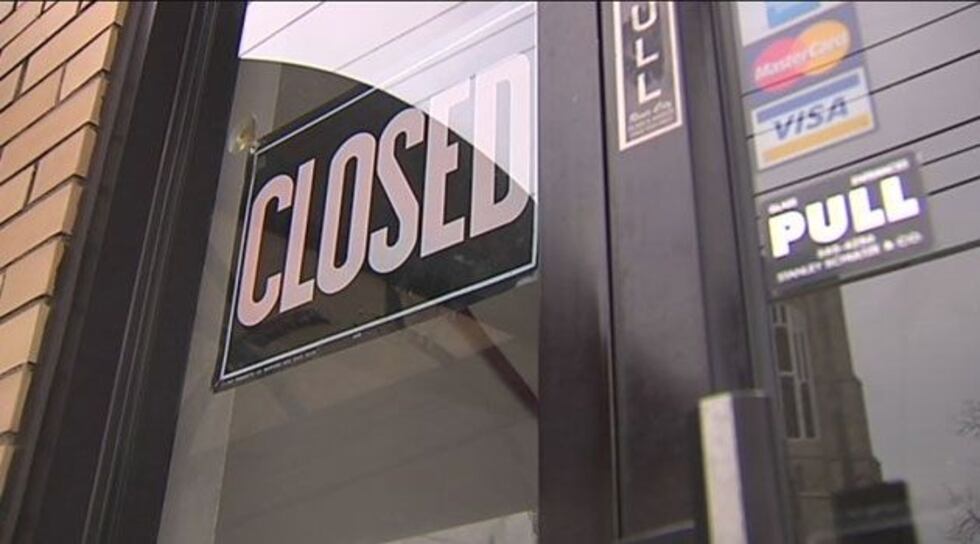 A 'closed' sign hangs in the door.