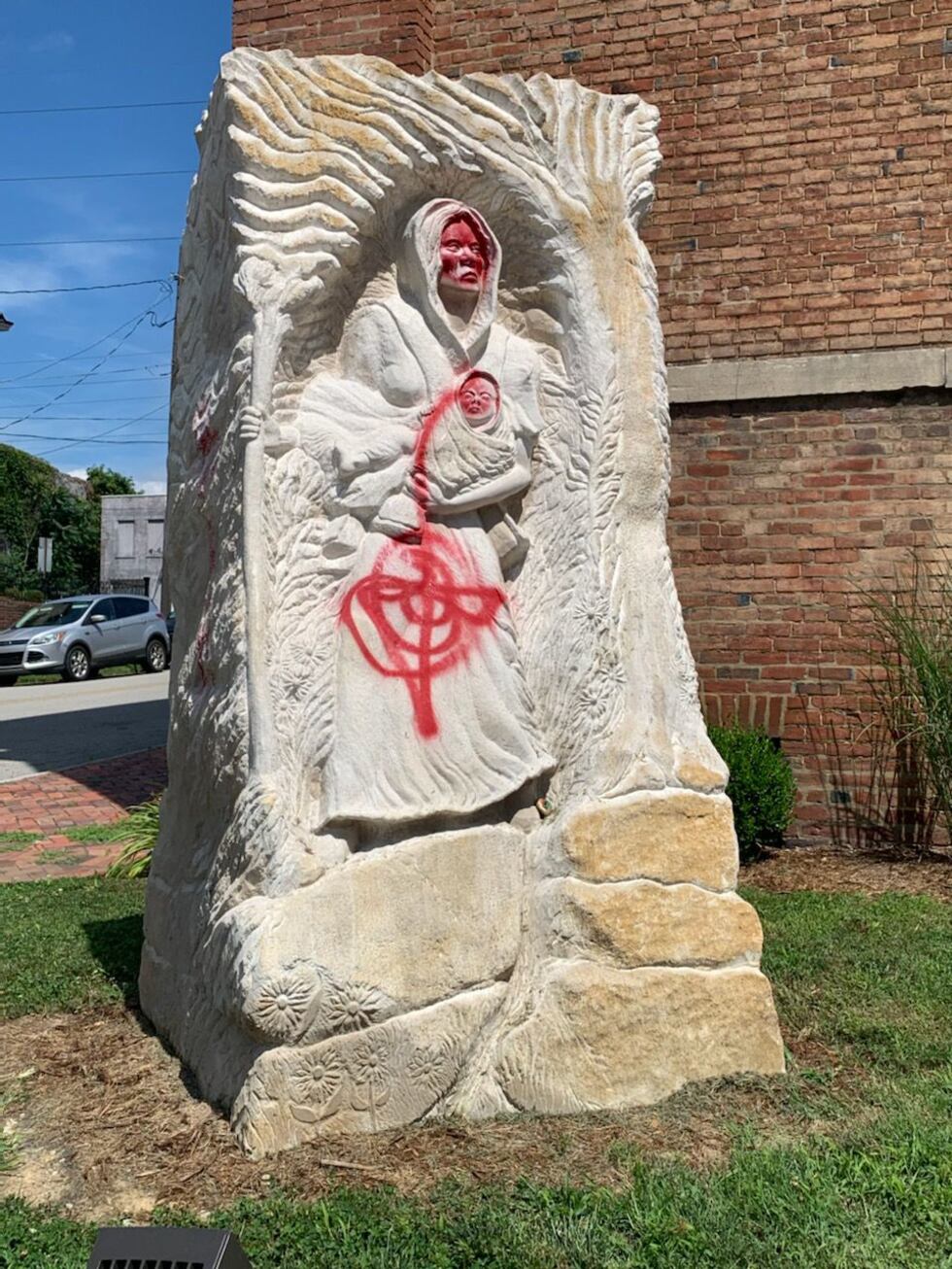 The statue of Lucy Higgs Nichols and her infant daughter was vandalized early Friday morning.
