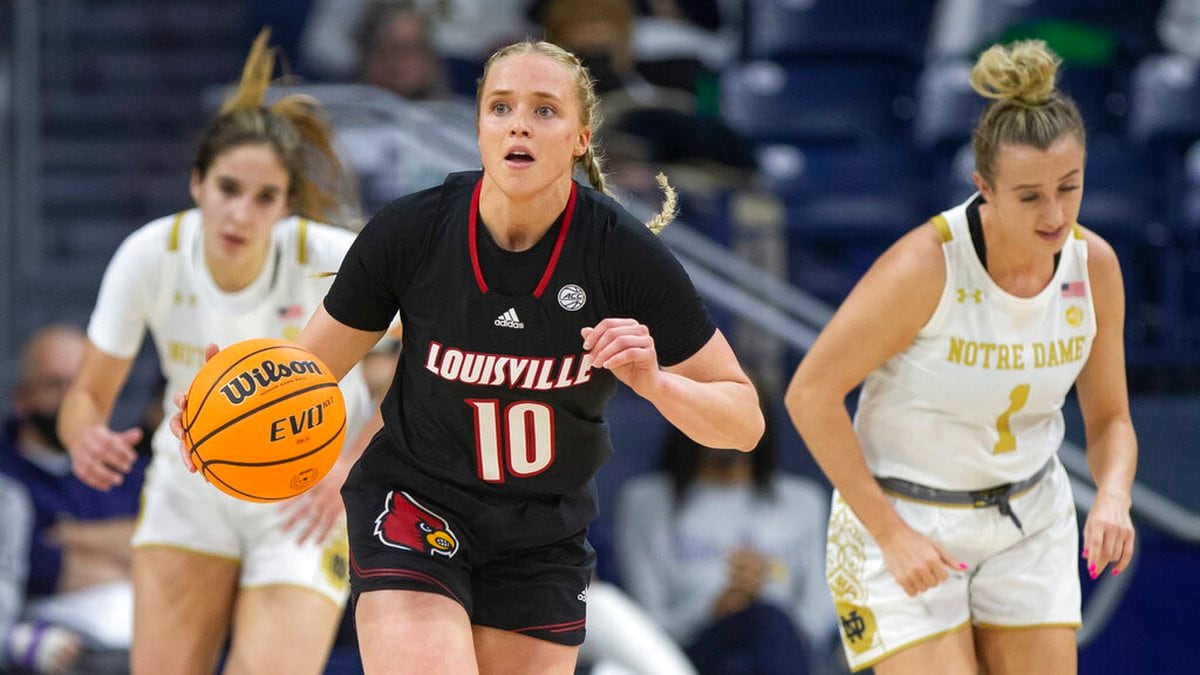 Louisville's Hailey Van Lith (10) drives downcourt next to Notre Dame's Dara Mabrey (1) during...